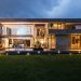 a beautiful home with outdoor lighting