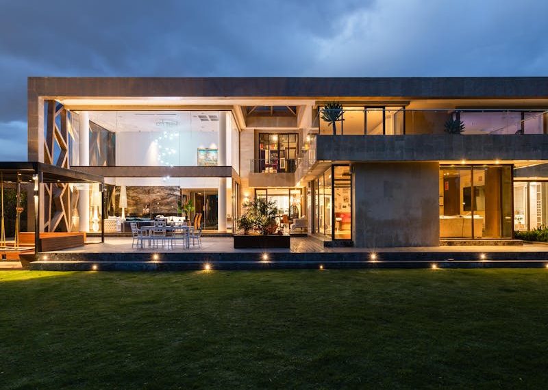 a beautiful home with outdoor lighting